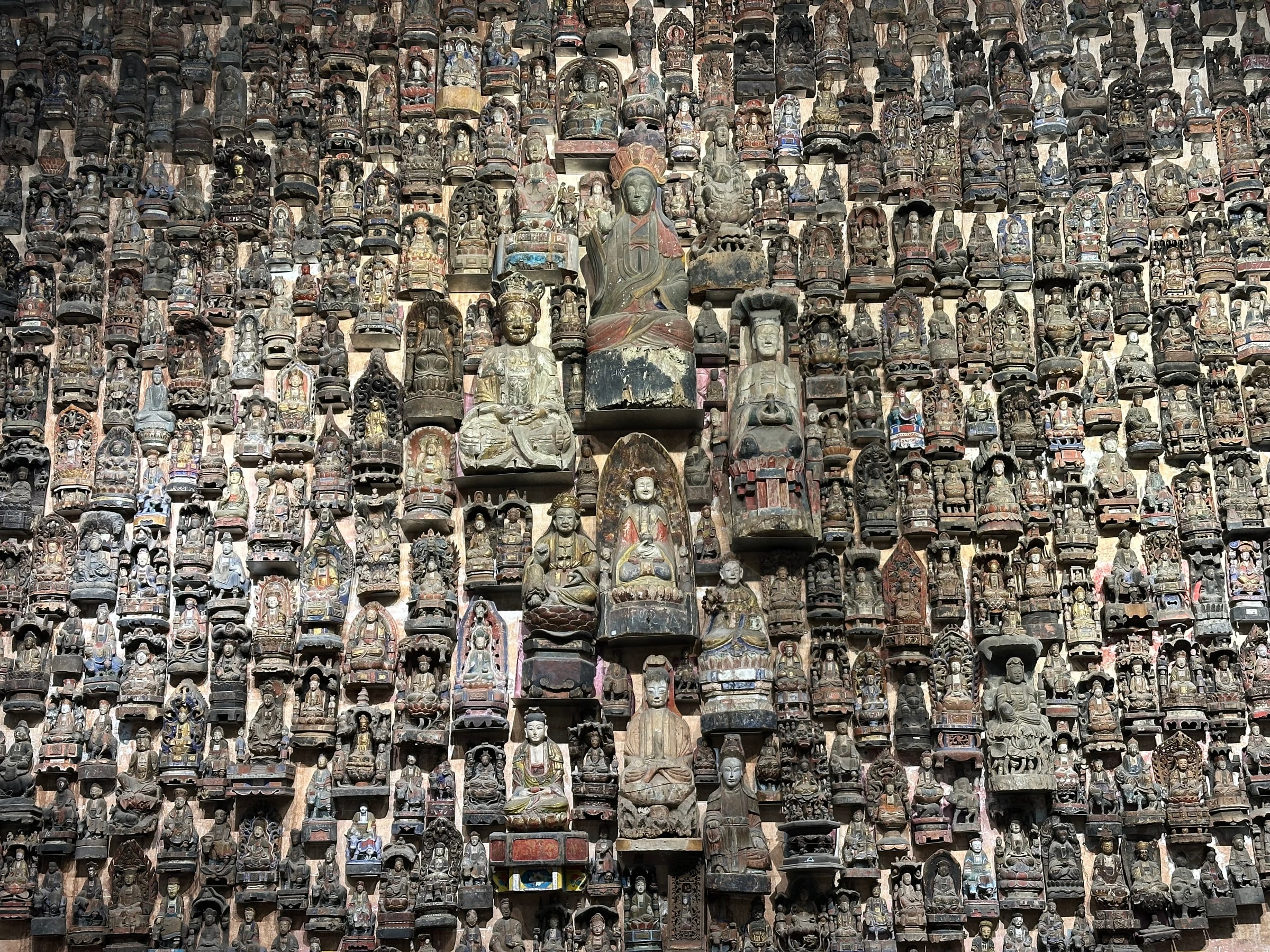 A collection of historic Buddhist figures in a suburban Chongqing museum